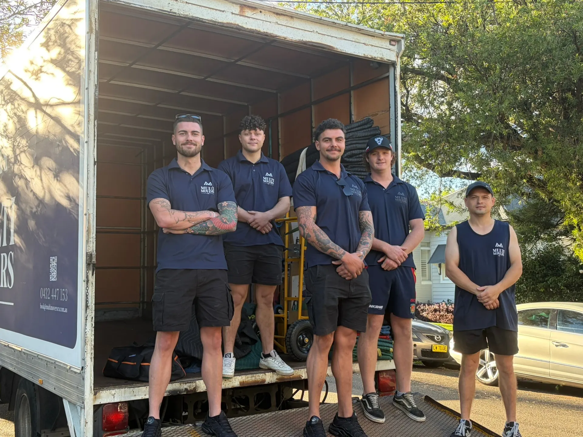 Professional movers carrying furniture